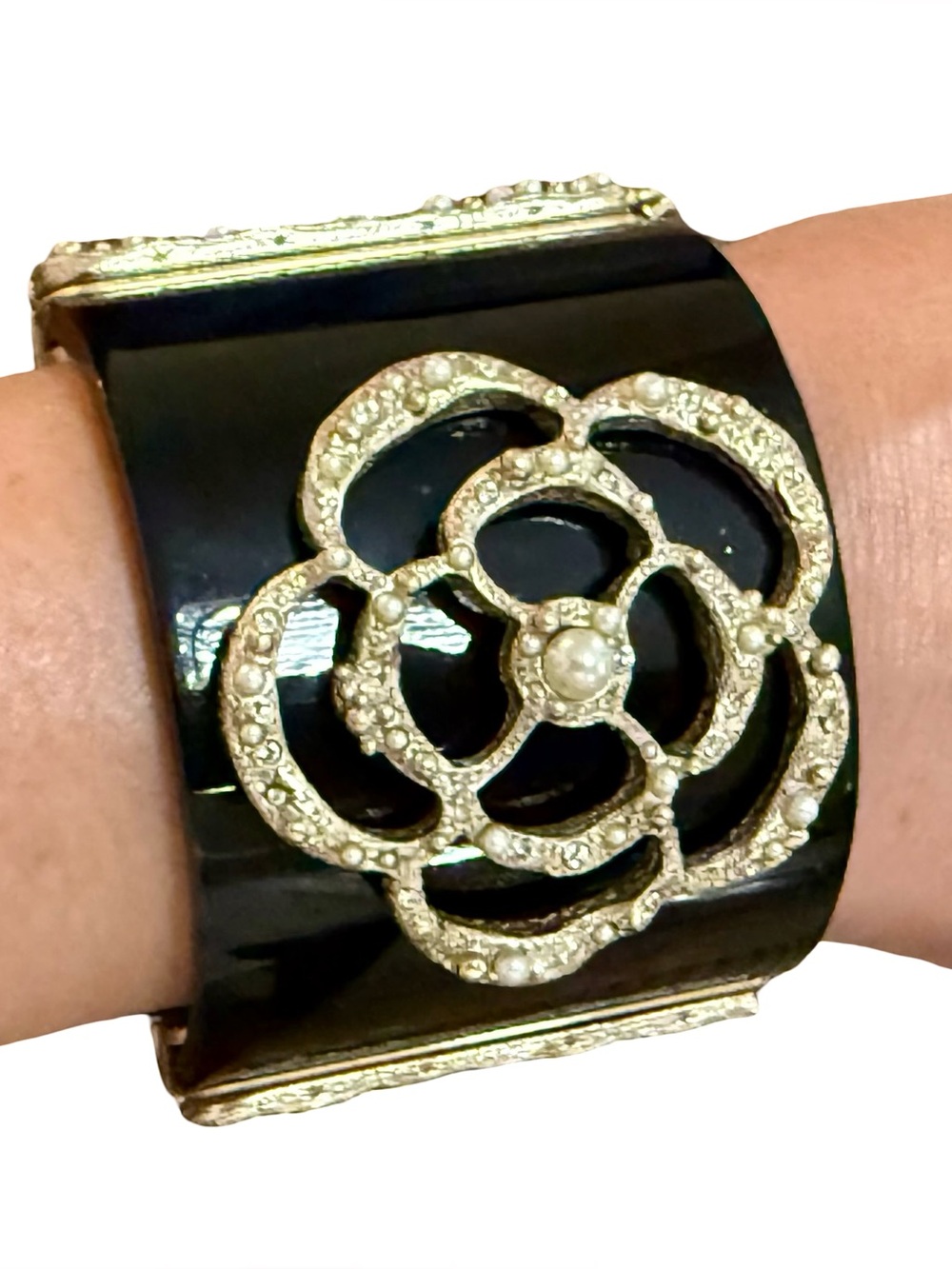 CHANEL BLACK RESIN WIDE CUFF WITH GOLDEN CAMELIA AND PEARLS EMBELLISHMENT